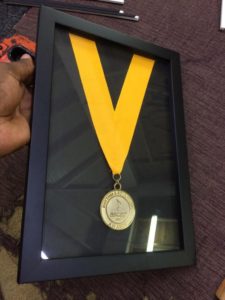 Memoribilia frame of a music award medal